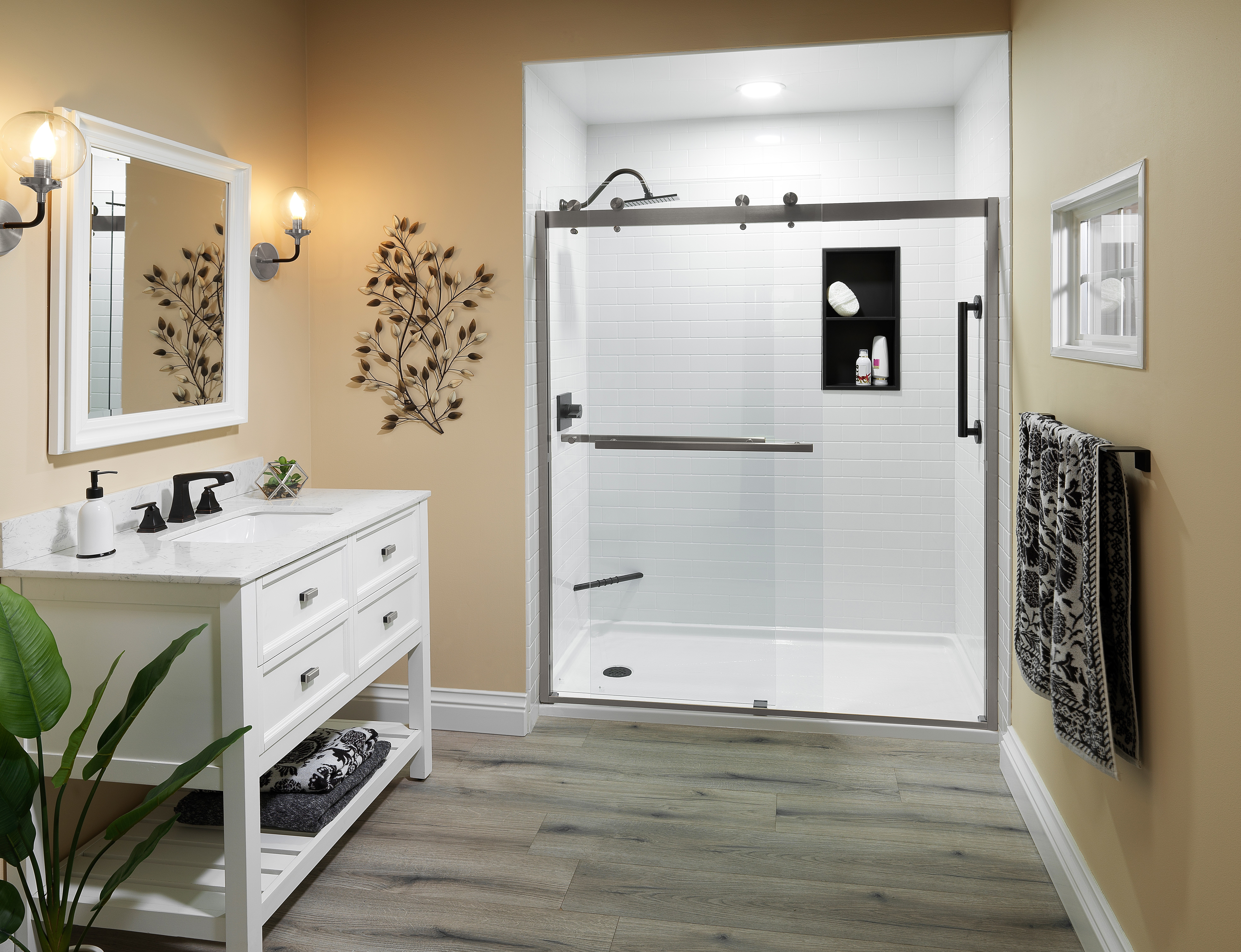 Yellow accent wall with white subway tile shower — cheerful bathroom remodel