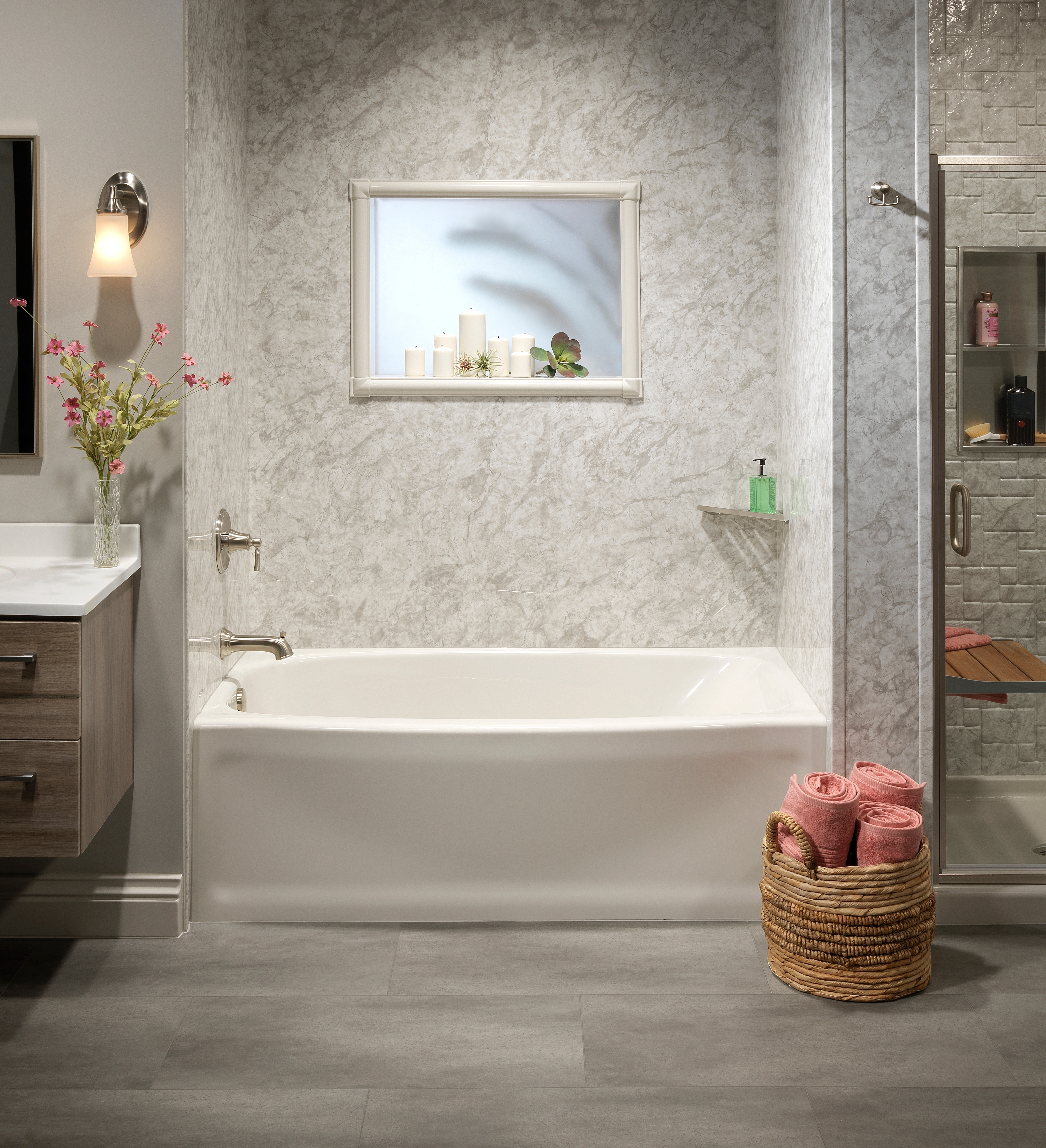 White freestanding tub with gray marble-look surround — North Texas bathroom