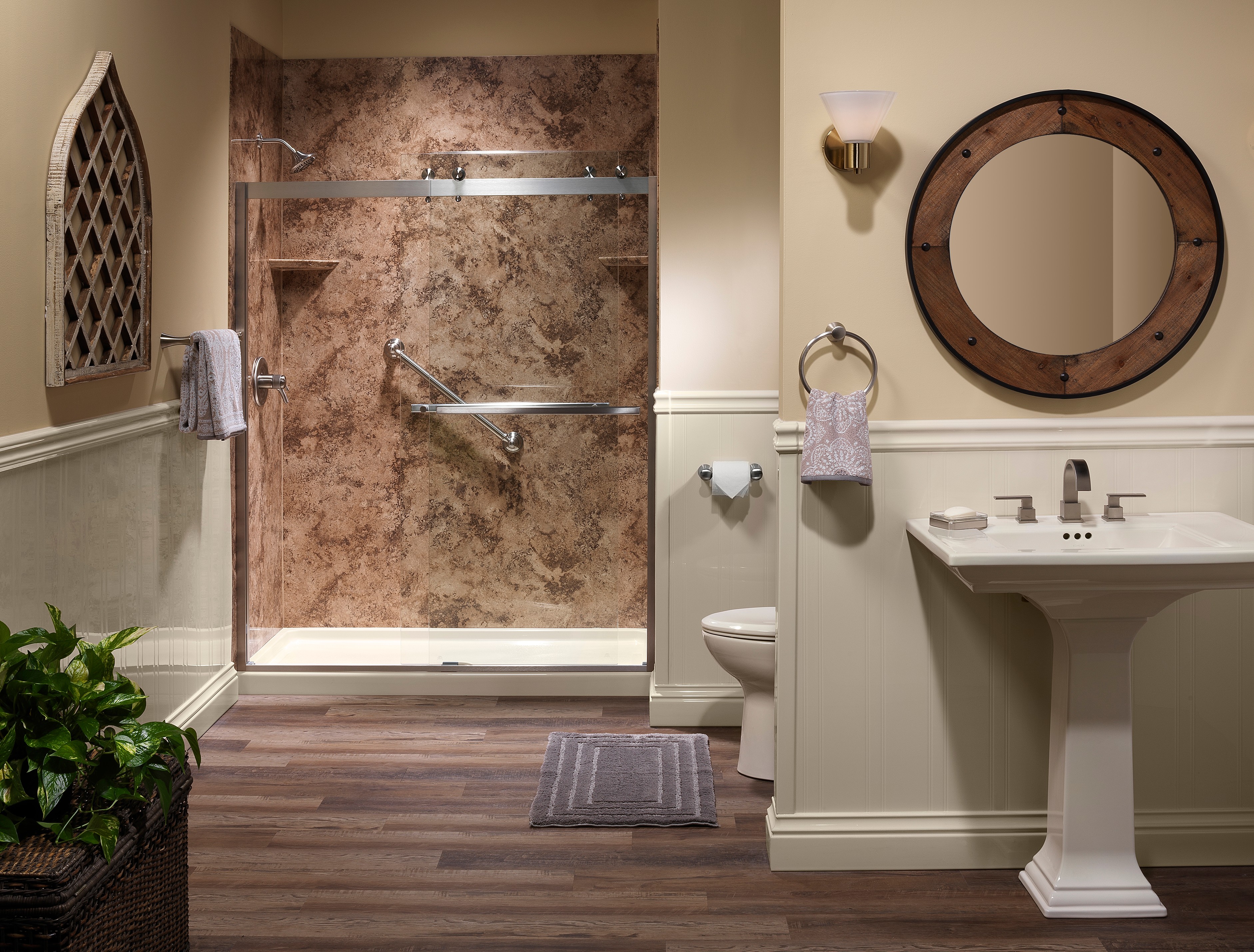 Pedestal sink with dark wood vanity and walk-in shower — Denton County