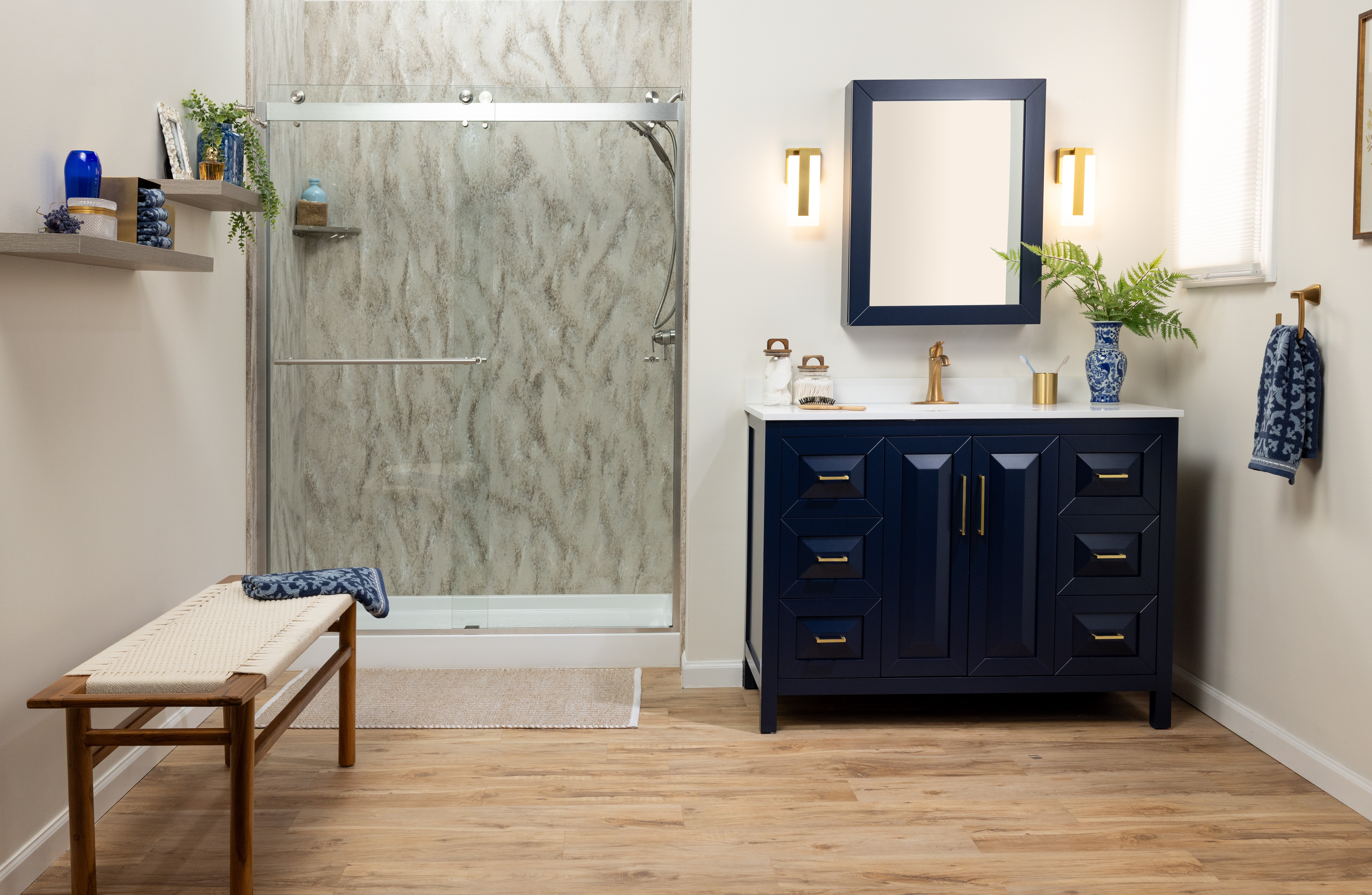 Dark navy vanity with gold fixtures and custom tile — DFW bathroom remodel